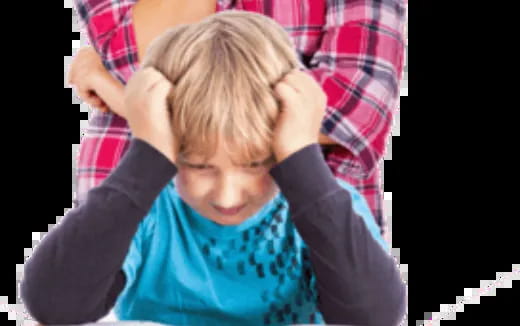 a child with his hands on his head