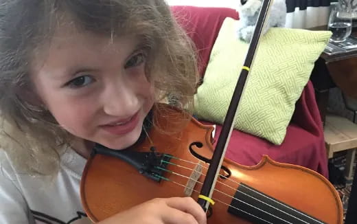 a girl playing a guitar