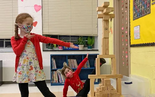a girl holding a toy