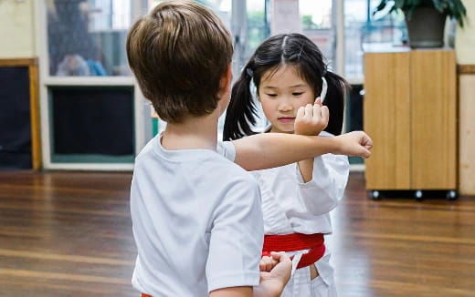 a boy and girl holding each other