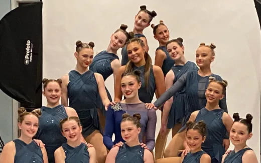 a group of people in blue shirts