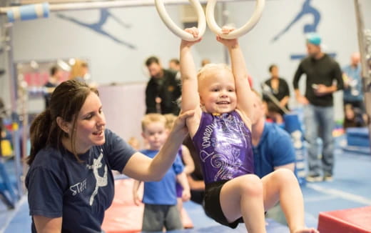 a group of people lifting weights