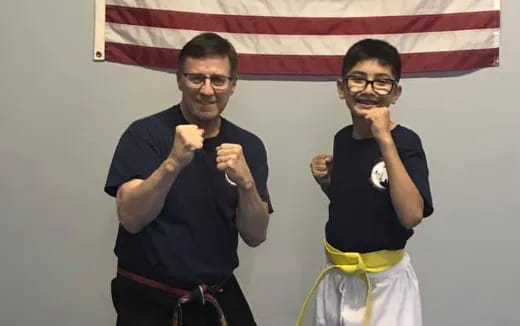 a couple of men posing for the camera