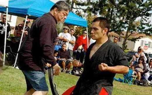 a person shaking hands with another man