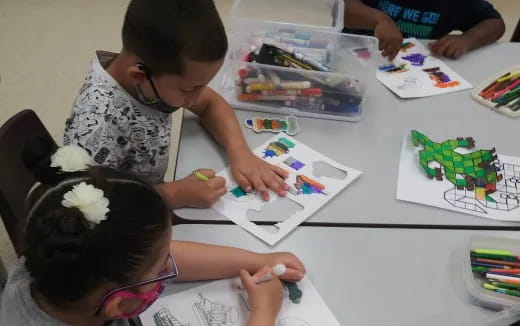 a group of children painting