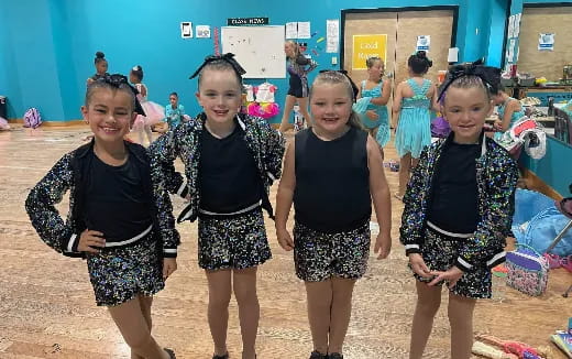 a group of girls posing for a photo