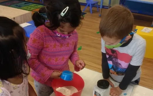 a group of children playing with toys