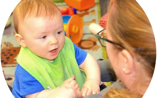 a person holding a baby