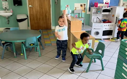 a couple of kids in a kitchen