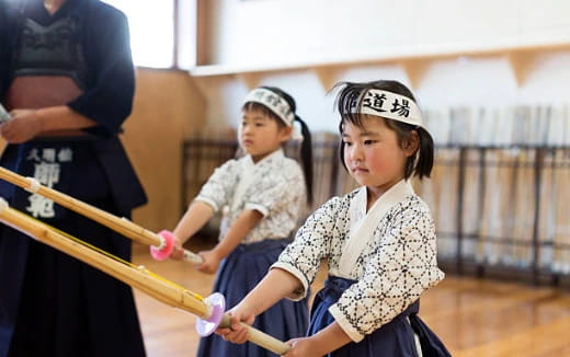 a few young girls holding toy guns