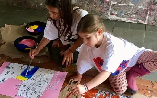 a few young girls painting