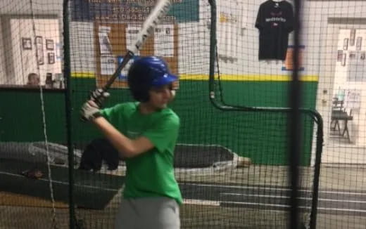 a young boy playing baseball