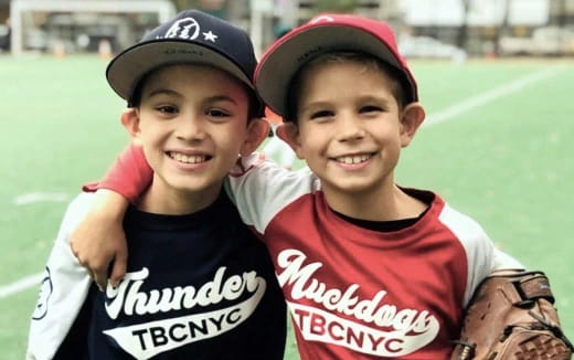 a couple of kids pose for a picture