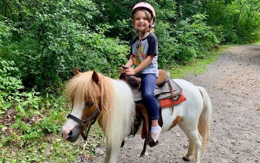 a girl riding a horse