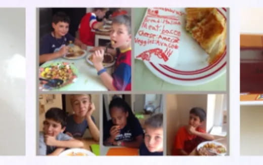 a group of kids eating at a table