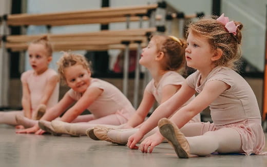 a group of children sitting on the floor