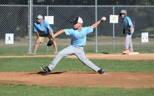 a baseball player throwing a ball