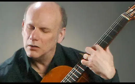 a man playing a guitar