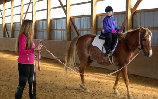 a girl riding a horse