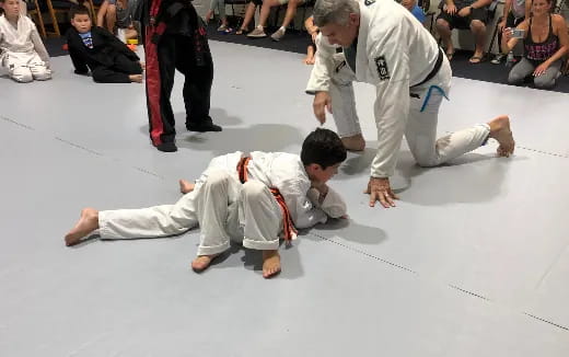 a group of people in karate uniforms