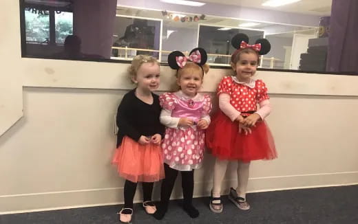 a group of girls posing for a photo