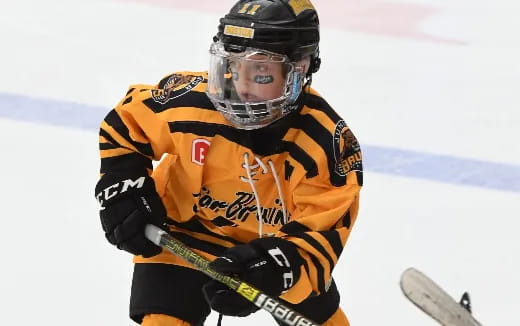 a hockey player in orange