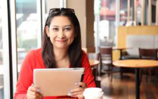 a woman holding a laptop
