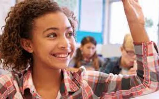 a woman with her arm raised