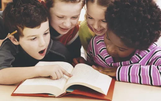 a group of children studying