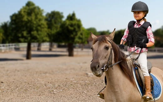 a girl riding a horse