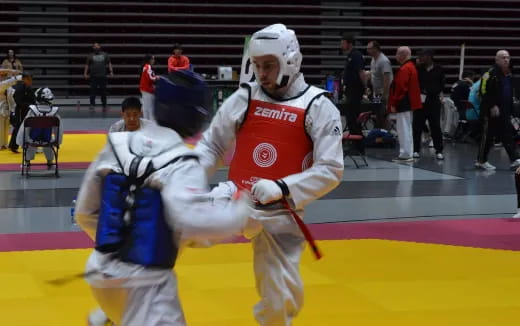 a couple of men playing hockey
