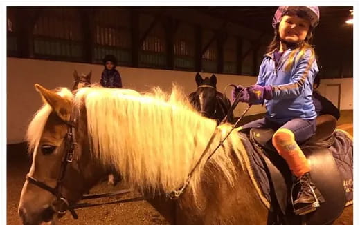 a girl riding a horse