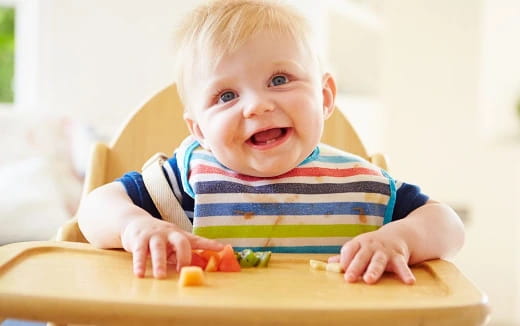 a baby playing with toys