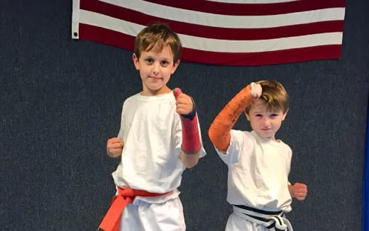 two boys in karate uniforms