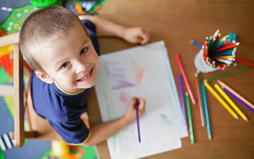 a child sitting at a table