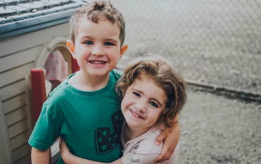 a boy and girl smiling