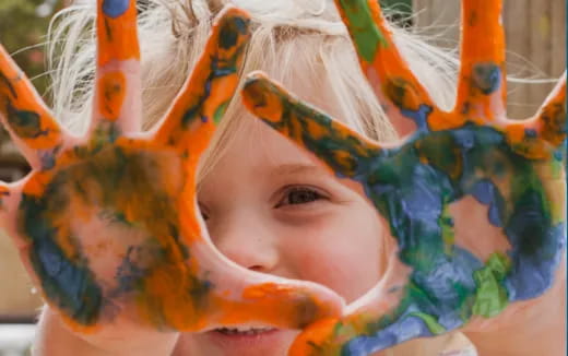a child wearing a colorful hat