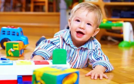 a baby playing with toys