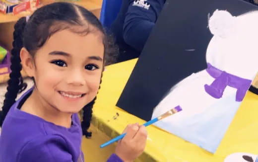 a young girl painting