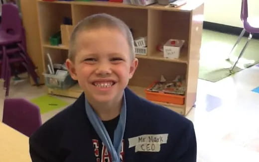 a boy smiling for the camera