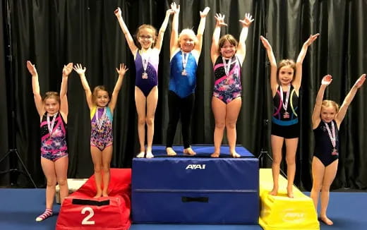 a group of girls on a stage