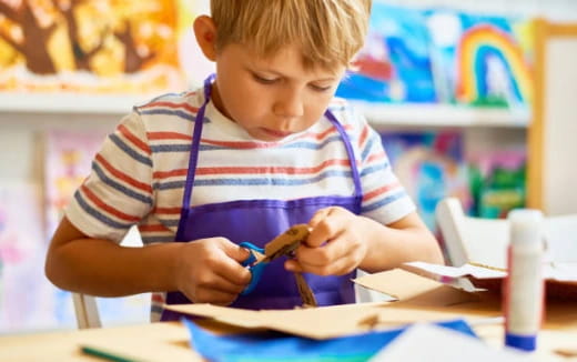 a young boy painting