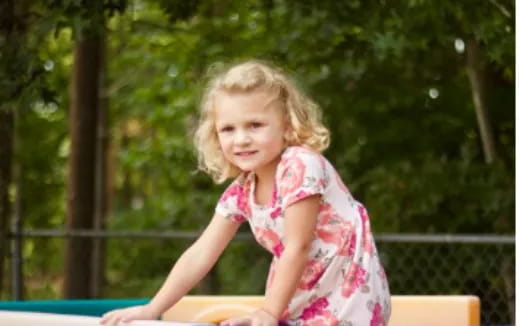 a girl sitting on a bench