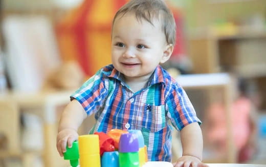 a child holding a toy