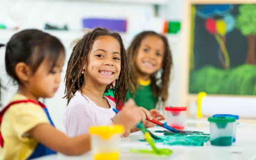 a group of children painting