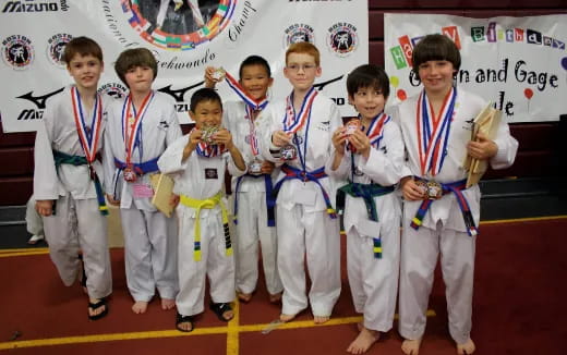 a group of boys in karate uniforms