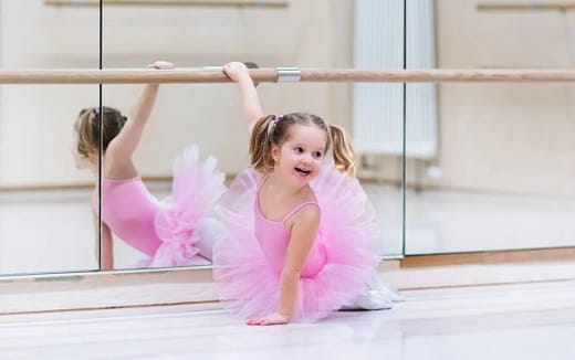 a girl in a pink outfit