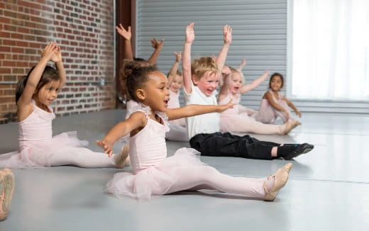 a group of children in white clothes