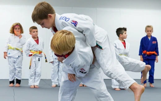 a group of people in karate uniforms