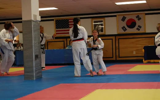 a group of people in karate uniforms